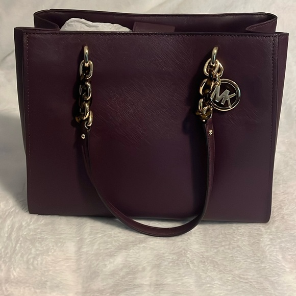 Brand new dark purple Michael Kors purse! Buttons at the top. Divides in center - Picture 1 of 6